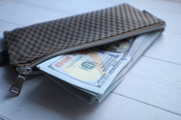 istock US dollar cash in a wallet, saving money concept 1212376748