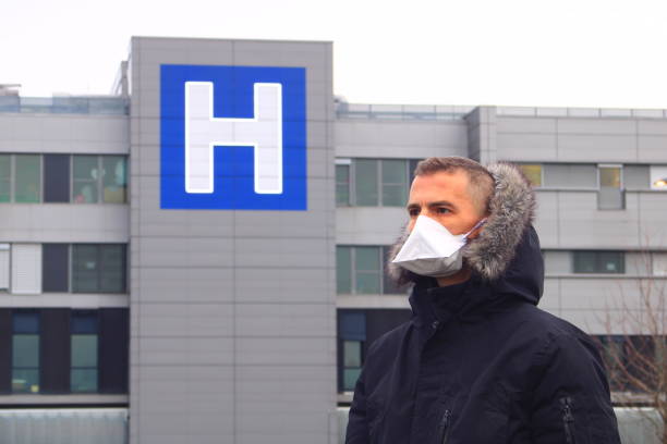 istock Person wearing a surgical mask. 1212376967