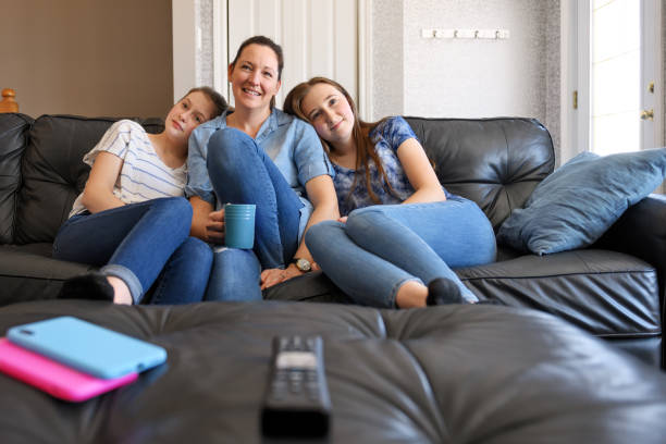 istock Family watching tv and using internet 1212379462