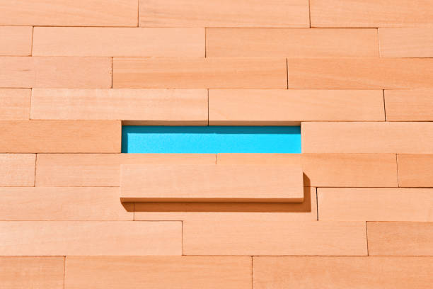 The wooden planks are staggered on a light blue in the center of an empty space for Your text. Abstract background.