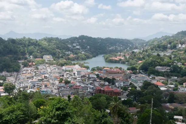 Photo of Scenic view of Kandy city in Sri lanka.Kandy is surrounded by mountains.The city's heart is scenic Kandy Lake (Bogambara Lake) and Temple of the Tooth (Sri Dalada Maligawa)