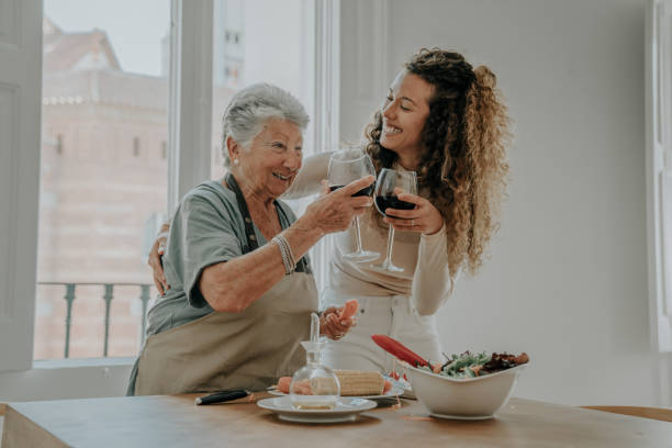 istock Mother and daughter preparing a salad 1212381904