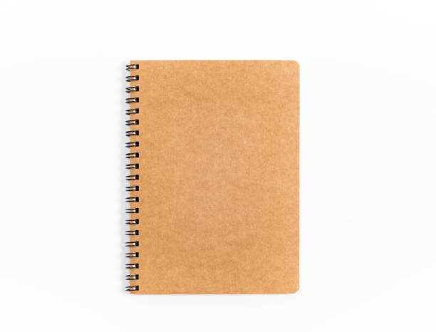 istock Brown spiral notebook isolated on white background.top view 1212382243