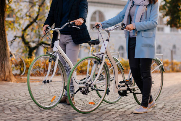 istock Couple Riding Bicycles In Autumn 1212384325