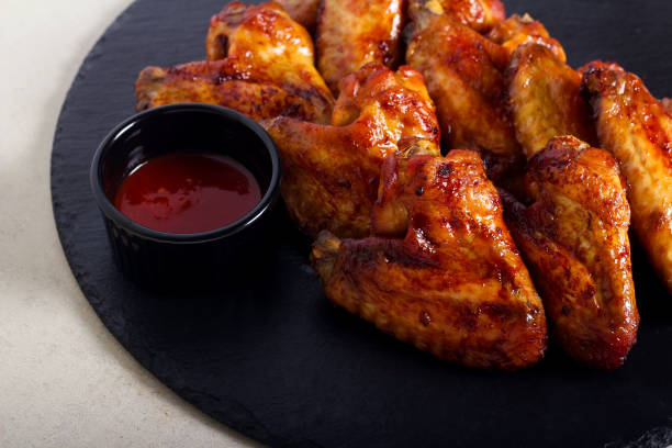 istock Roast glazed chicken wings served 1212385131