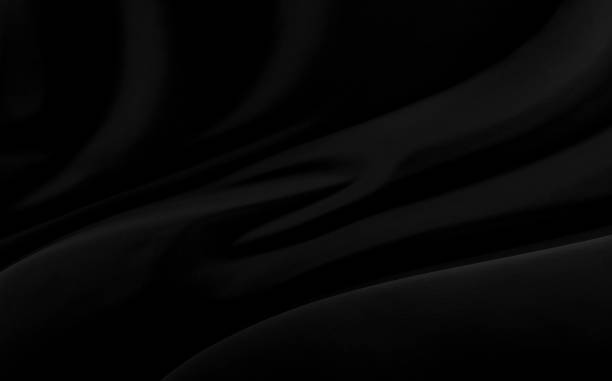 istock Black gray satin dark fabric texture luxurious shiny that is abstract silk cloth background with patterns soft waves blur beautiful. 1212385254