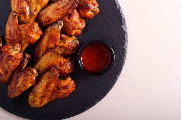 istock Roast glazed chicken wings served 1212385901