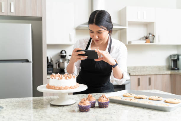 istock Young Attractive Influencer Photographing At Home 1212386433