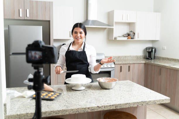 istock Attractive Young Vlogger Preparing Dessert In Kitchen 1212387266