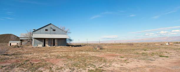 istock Rundown building by the highway 1212388812