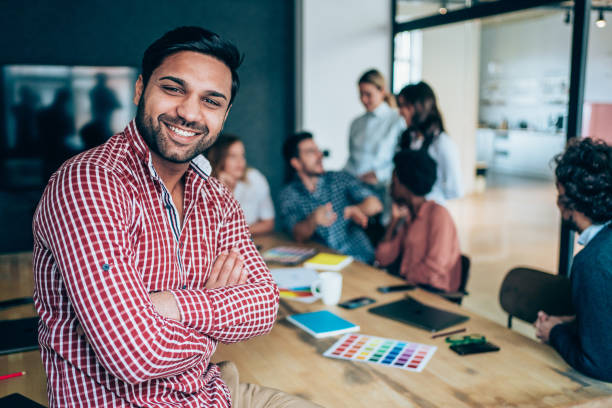istock Confident businessman and his team. 1212391100