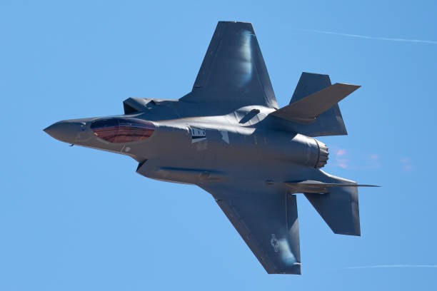 istock F-35 Lightning II  approaching  with afterburner on and condensation trails at the wing 1212394049