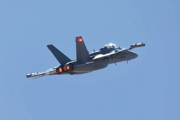 Photo of Tail view of a EA-18G Growler in beautiful light, with afterburners on