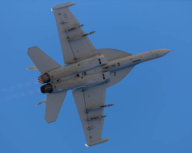istock EA-18G Growler in a turn,  with afterburners on 1212394171