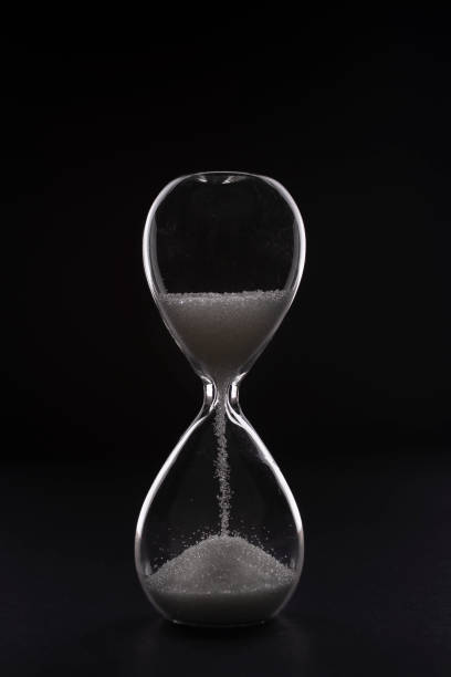istock hourglass on a black background 1212394393