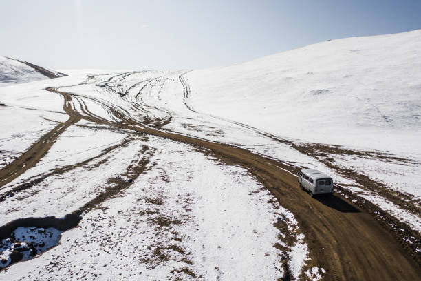 istock Aerial view of van on remote road in Mongolia 1212395732
