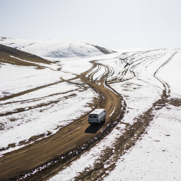 istock Aerial view of van on remote road in Mongolia 1212395752