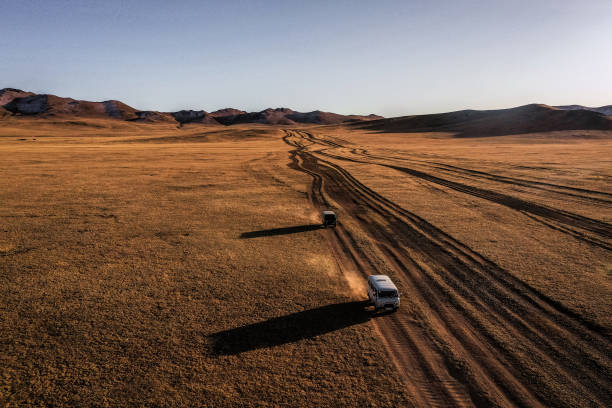 istock Aerial view of road through steppe at sunset 1212395766