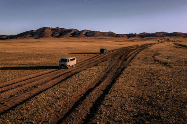 istock Aerial view of road through steppe at sunset 1212395793