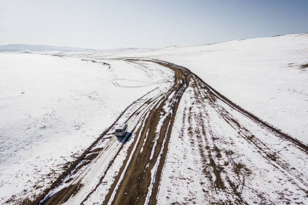 istock Aerial view of van on remote road in Mongolia 1212395804