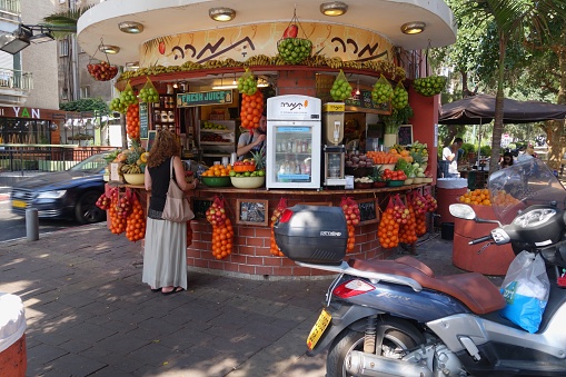 Tel Aviv, Israel - May 8, 2015: Kiosk on the Dizengoff Street in Tel Aviv, Israel. Some unidentified people in the background.