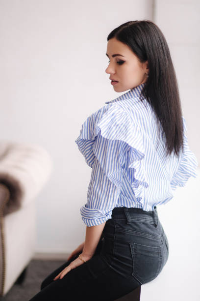 istock Attractive young model demonstrating clothes. Spring colections on elegant brunette woman. Demin style 1212397126