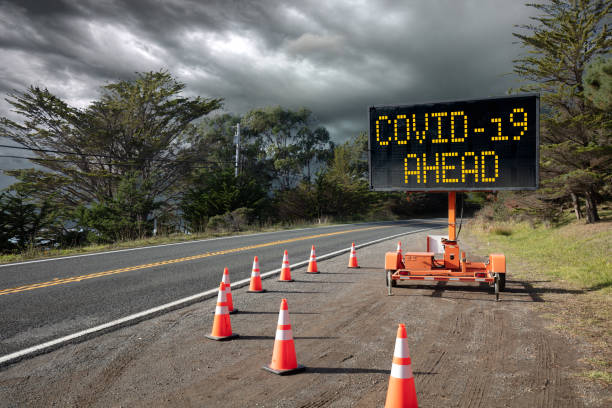 istock Covid-19 warning sign, stormy sky concept for Coronavirus 1212398304