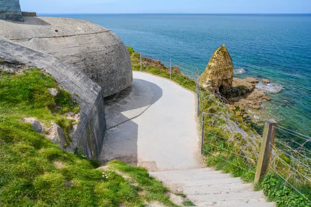 Photo of Pointe du Hoc, famous World War II site, on a sunny summer day, in Normandy, France