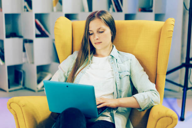 istock Young lady boss entrepreneur in a comfortable chair 1212400698