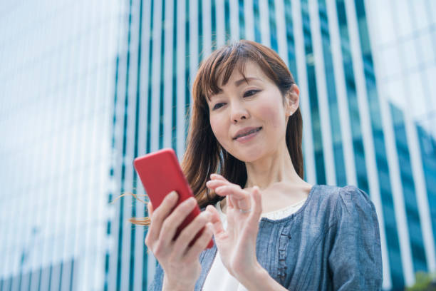 istock Business woman using a smartphone 1212401600