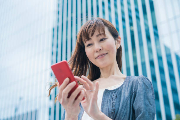 istock Business woman using a smartphone 1212401614