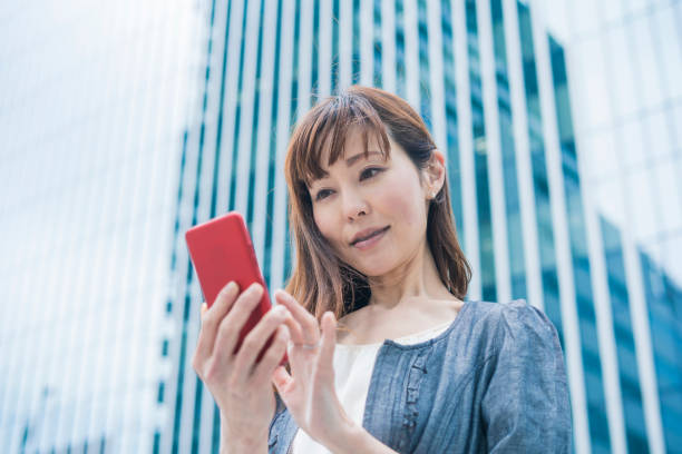 istock Business woman using a smartphone 1212401616