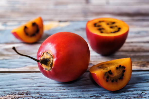 Ripe Tamarillo fruit with slices stock photo