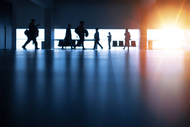 istock People Walking at Airport 1212409715
