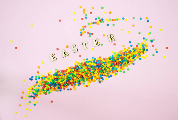 istock Abstract easter card with scattered color confectionery balls and letters. Easter holiday concept. 1212409791