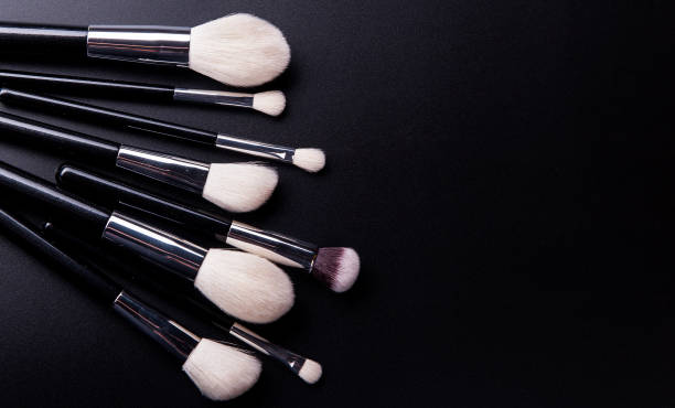 istock Make up brush lie on a black background 1212413434