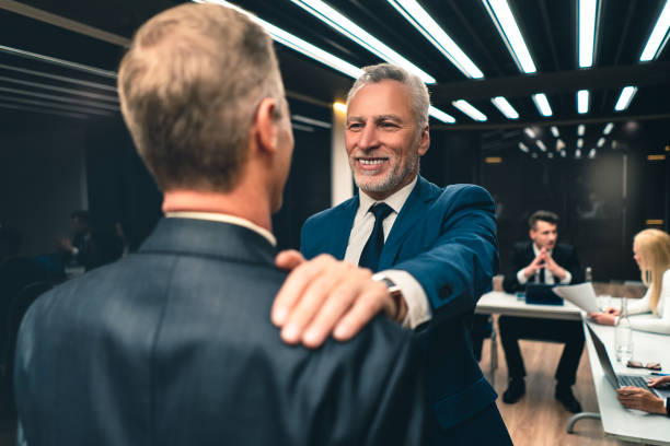 istock The businessmen handshaking each other 1212419410