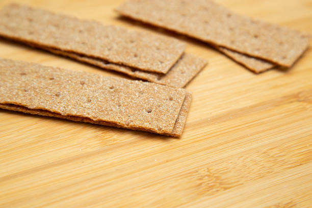 istock Crunchy bread on a wooden background. 1212420419