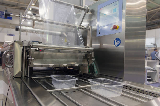 istock Machine for packing food products close-up. Industry 1212423454