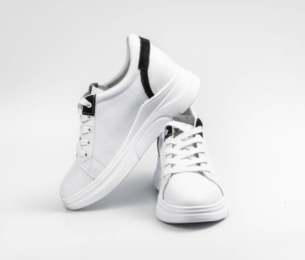 istock New unbranded running shoe, sneaker or trainer isolated on white background 1212426552