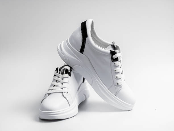 istock New unbranded running shoe, sneaker or trainer isolated on white background 1212426578