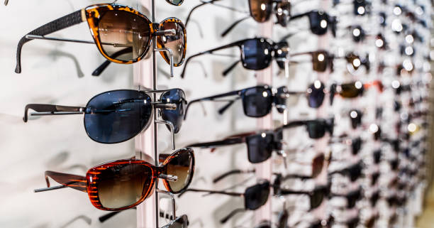 istock Sunglasses on display shelves in glasses store 1212426641
