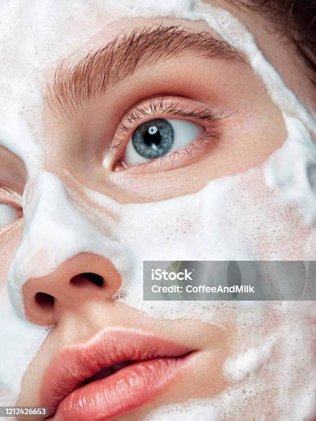 Beautiful Woman Applying Cleaning Foam On The Skin Stock Photo - Download Image Now - Exfoliation, Human Face, Acne