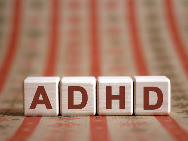 istock ADHD - medical concept. Attention deficit hyperactivity disorder. Wooden cubes on a color table. 1212426788