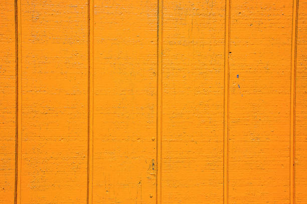 istock Orange color painted wooden building exterior surface 1212430065