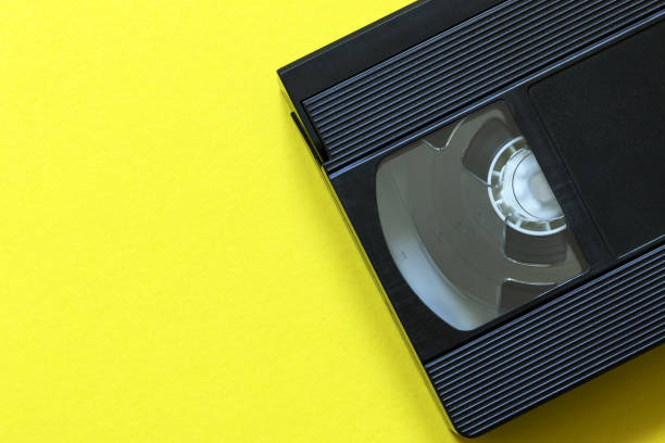 istock Video tape on yellow color background 1212431284