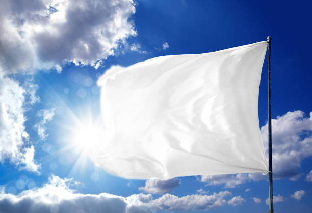 waving blank white flag over sunny blue sky