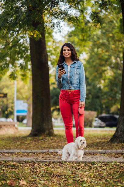 istock Woman standing in the park 1212440439