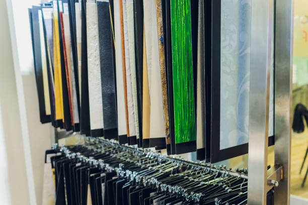 istock Interior designer's workplace. Architectural project architectural plan, color swatches at the desk. 1212440582