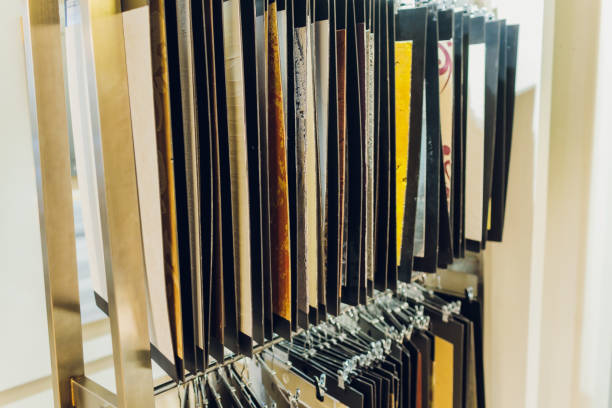 istock Interior designer's workplace. Architectural project architectural plan, color swatches at the desk. 1212440587